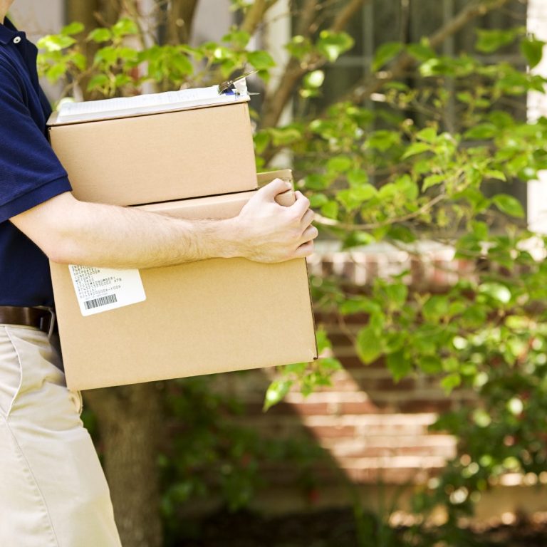 Courier collecting forgotten items from Eurostar lost and found at St Pancras for delivery to USA and Europe